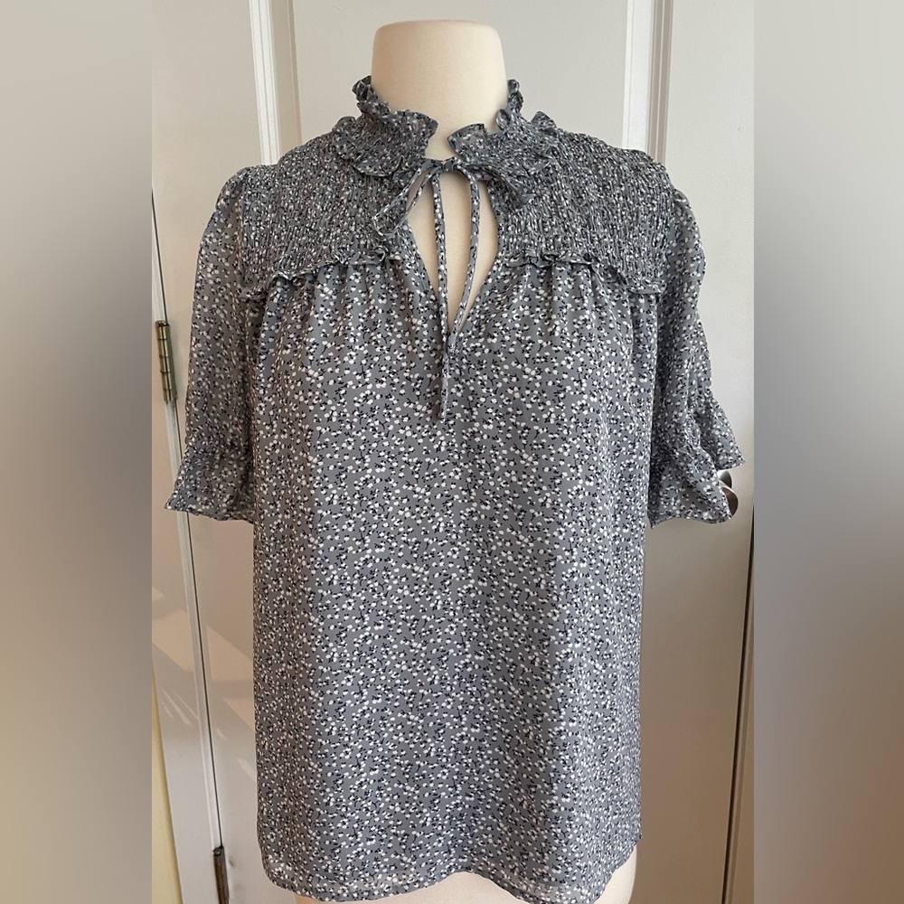 Pleione Smocked Neck Gray Floral Blouse with Ruffled Sleeves.
